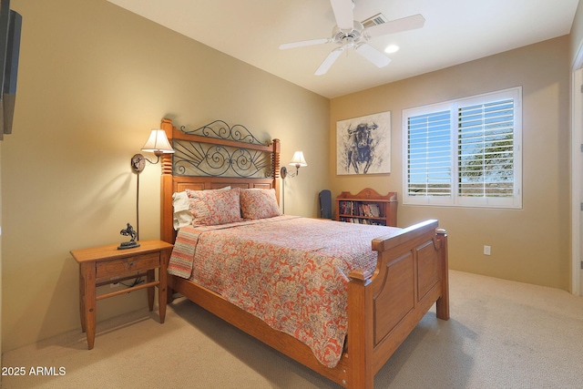 carpeted bedroom with ceiling fan