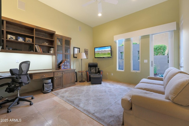 office space with ceiling fan and light tile patterned floors