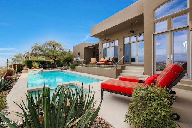 view of pool featuring french doors, ceiling fan, and a patio area