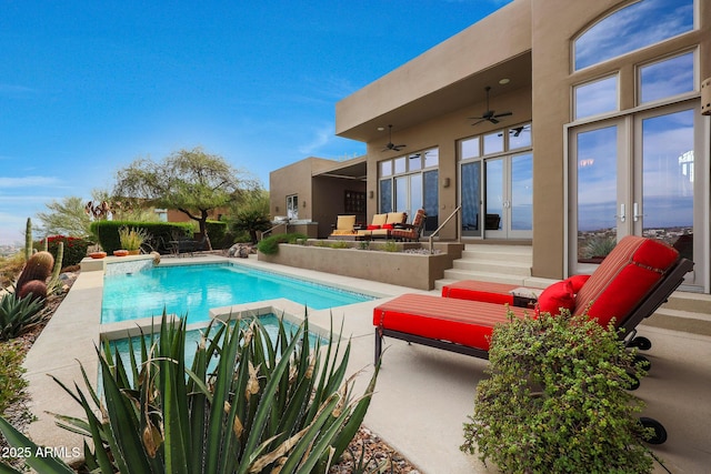 view of pool with ceiling fan, french doors, and a patio