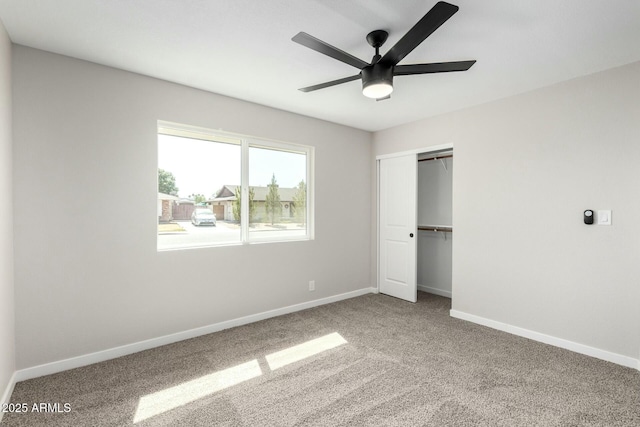 unfurnished bedroom with baseboards and carpet flooring