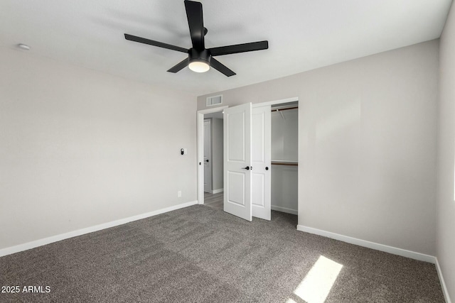 unfurnished bedroom featuring a closet, baseboards, visible vents, and carpet flooring