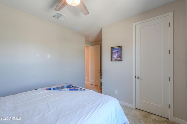 bedroom with baseboards, light carpet, a ceiling fan, and visible vents