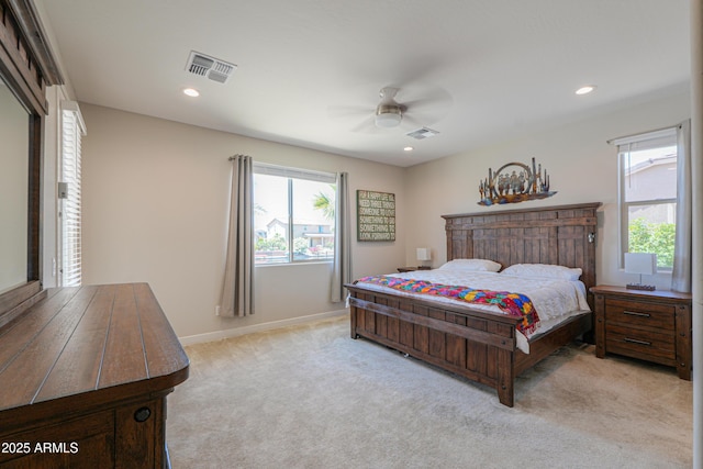 bedroom with visible vents, baseboards, ceiling fan, and light colored carpet