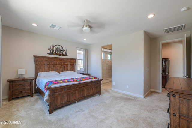 bedroom with visible vents, baseboards, and light carpet
