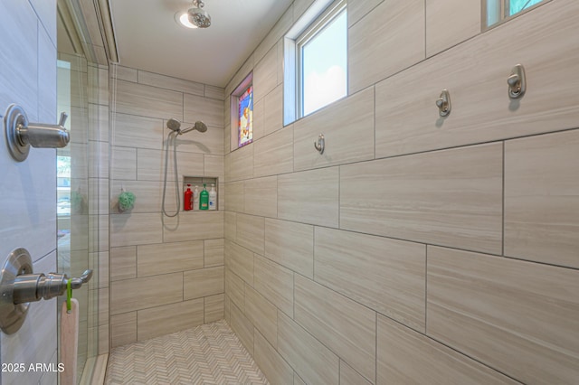 full bathroom with a tile shower