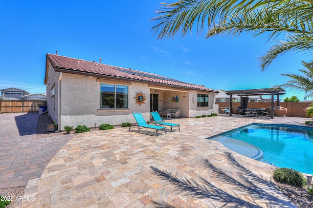 view of swimming pool featuring a pergola, a fenced in pool, a fenced backyard, and a patio area