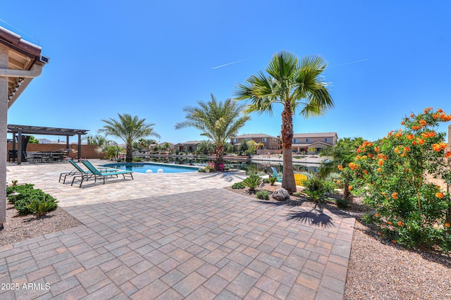 community pool featuring a pergola and a patio area