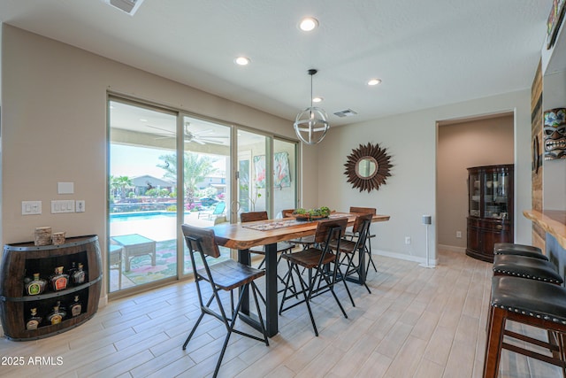 dining area with visible vents, recessed lighting, baseboards, and light wood-type flooring