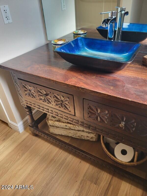 room details featuring sink and wood-type flooring