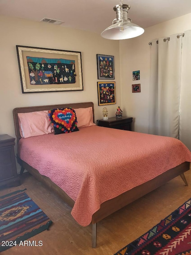 bedroom featuring hardwood / wood-style flooring