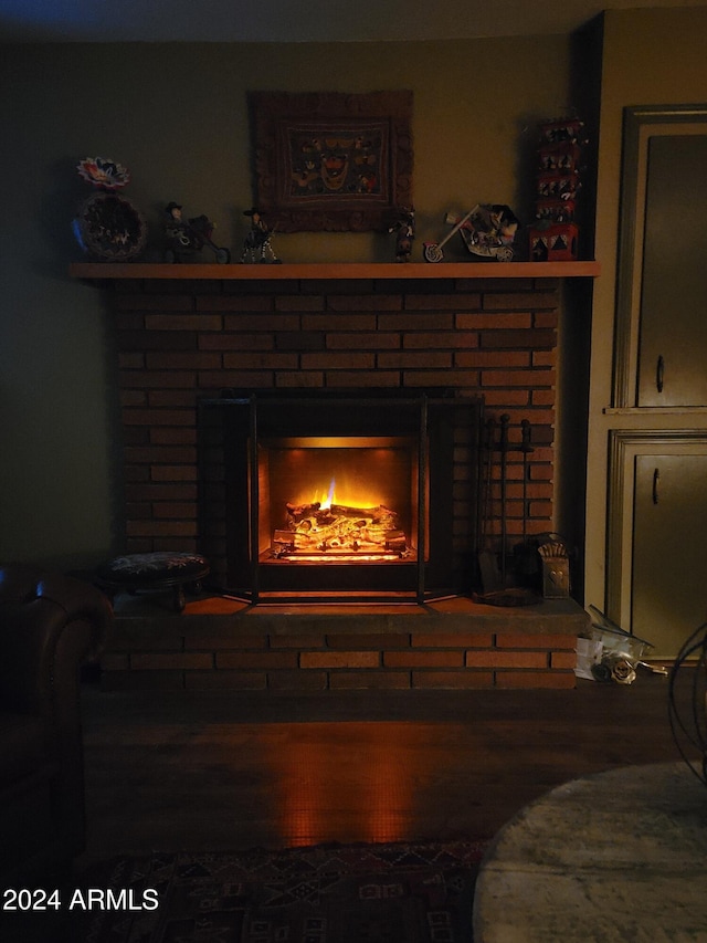 interior details featuring wood-type flooring and a fireplace