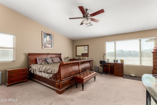 bedroom with light carpet, ceiling fan, and vaulted ceiling