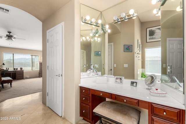 bathroom with a ceiling fan, tile patterned flooring, visible vents, and vanity