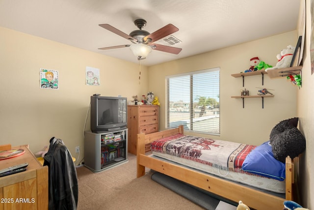 bedroom featuring carpet floors, visible vents, and ceiling fan