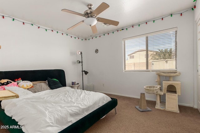 carpeted bedroom with a ceiling fan and baseboards
