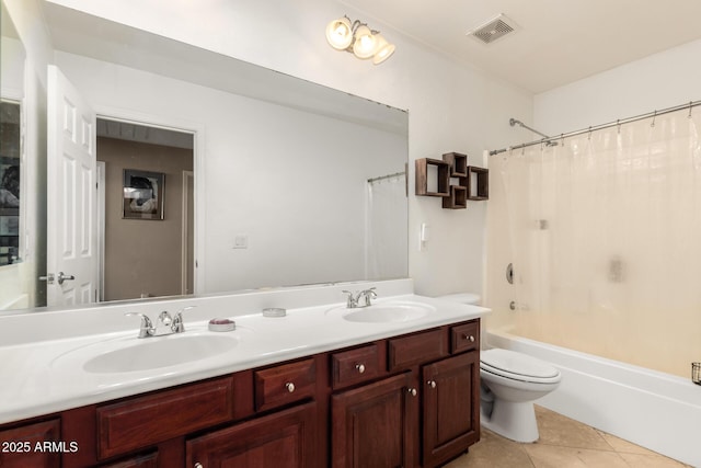 bathroom featuring double vanity, tile patterned flooring, a sink, and visible vents
