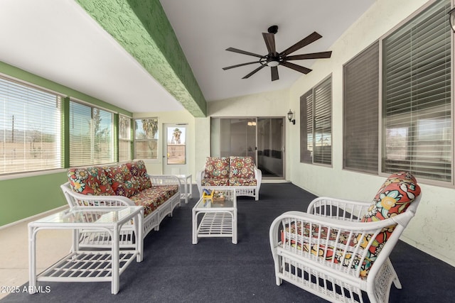 sunroom with vaulted ceiling and a ceiling fan