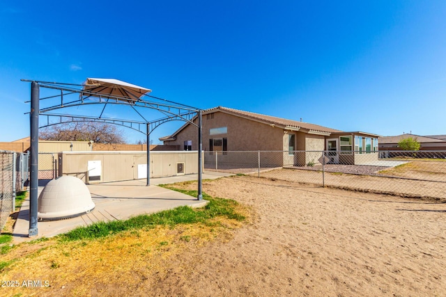 exterior space featuring a patio area and fence