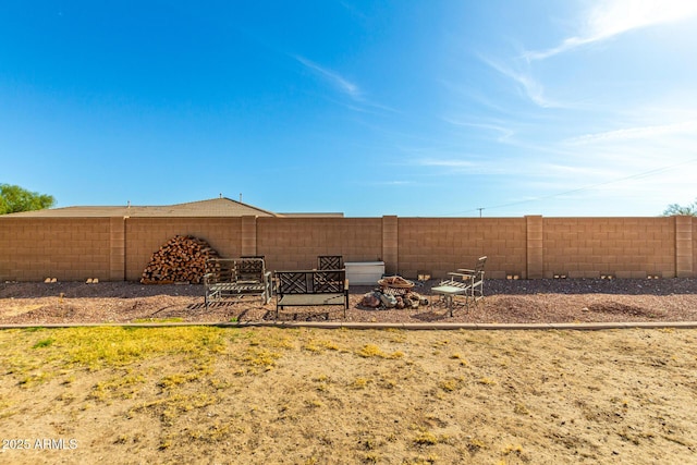 view of yard with a fenced backyard