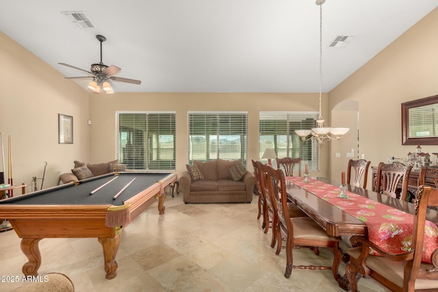 recreation room with visible vents, vaulted ceiling, and ceiling fan
