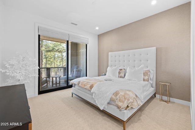carpeted bedroom featuring access to exterior