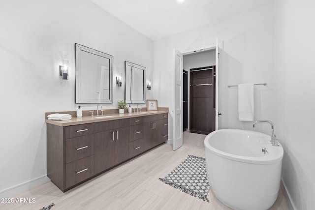 bathroom featuring vanity and a bathtub