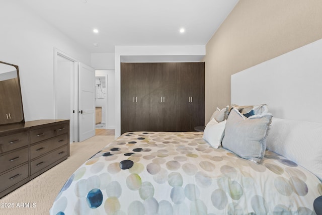 carpeted bedroom featuring a closet