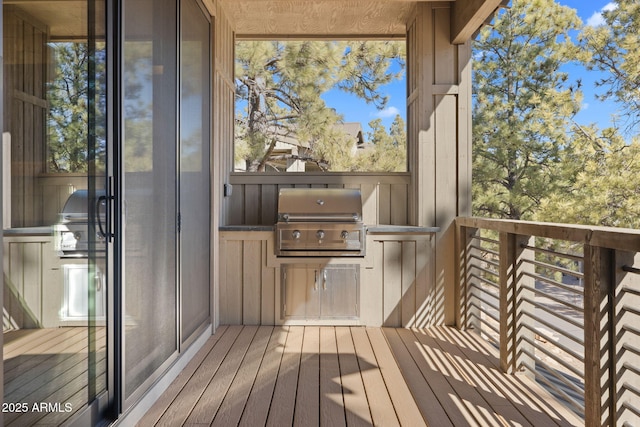 balcony with area for grilling and a grill