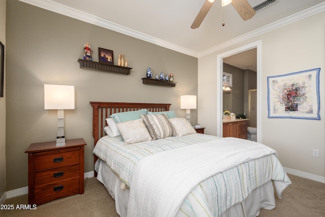 carpeted bedroom featuring ensuite bathroom, ceiling fan, and crown molding