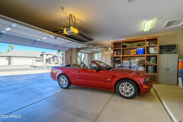 garage featuring a garage door opener