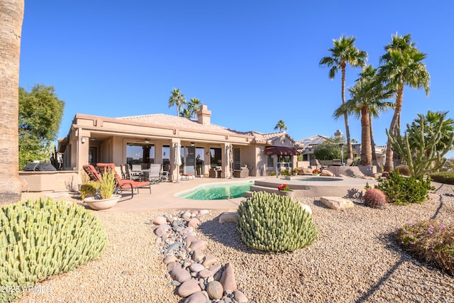 rear view of house featuring a patio area and ceiling fan