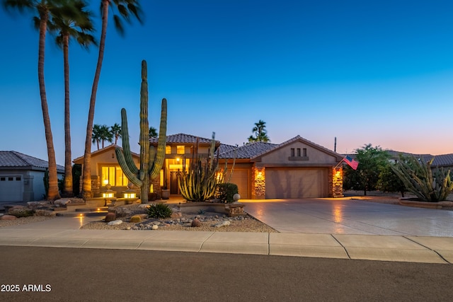 view of front of property with a garage