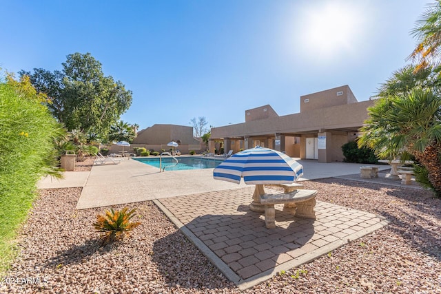 community pool with a patio area