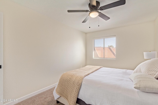 bedroom with carpet floors, ceiling fan, and baseboards