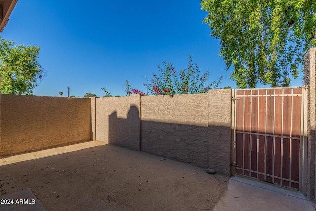 view of gate with fence