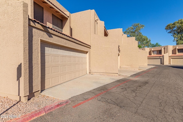 exterior space featuring driveway