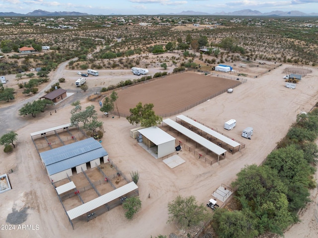 aerial view featuring a desert view and a mountain view