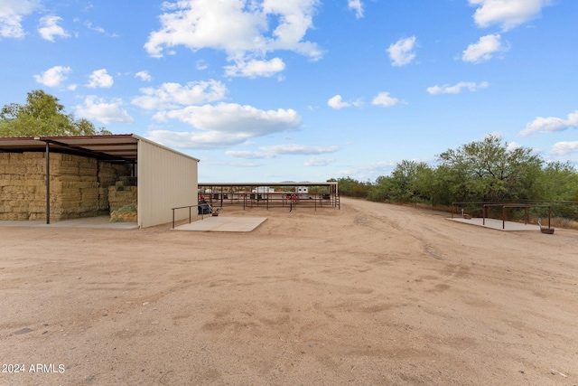 view of yard featuring an exterior structure and an outdoor structure