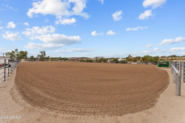 view of yard with a rural view and an enclosed area