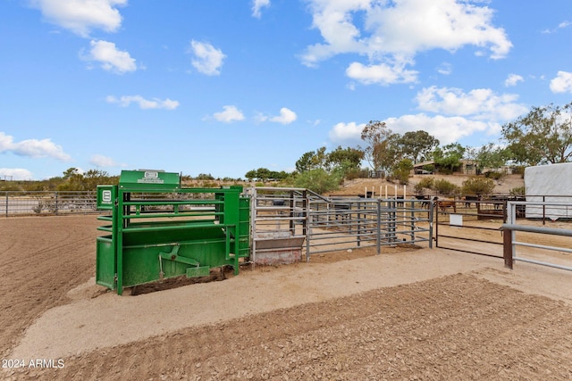 view of stable with a rural view