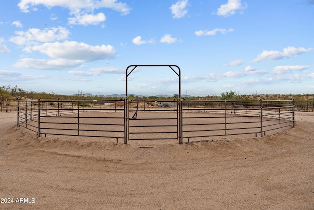 view of yard featuring an enclosed area and a rural view