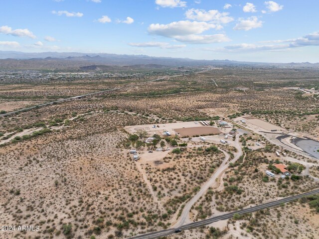 birds eye view of property with a mountain view