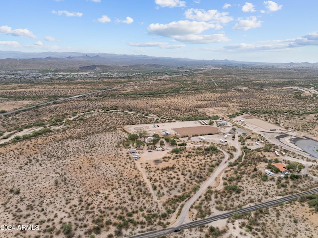 aerial view featuring a mountain view and a desert view