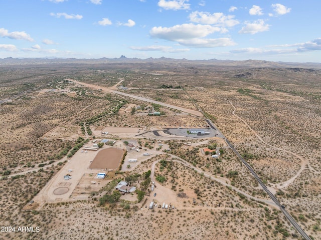 birds eye view of property with a mountain view