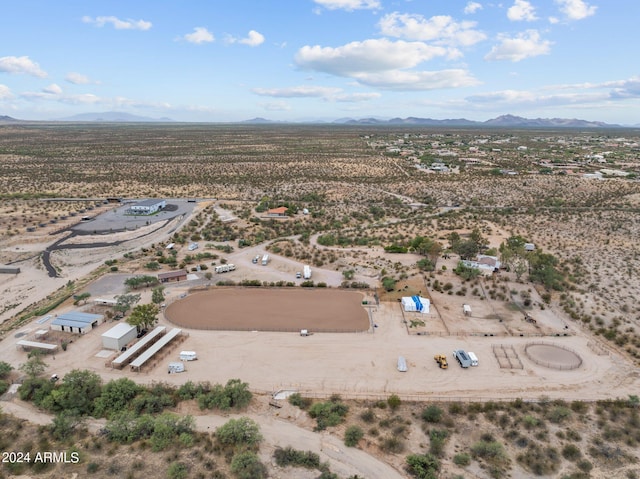 birds eye view of property featuring view of desert, a rural view, and a mountain view