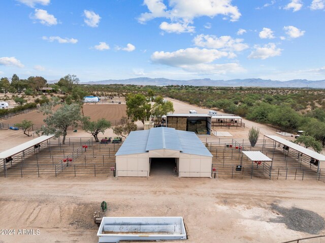 birds eye view of property featuring a mountain view