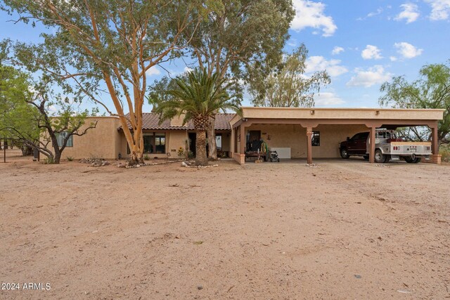 rear view of house with a carport