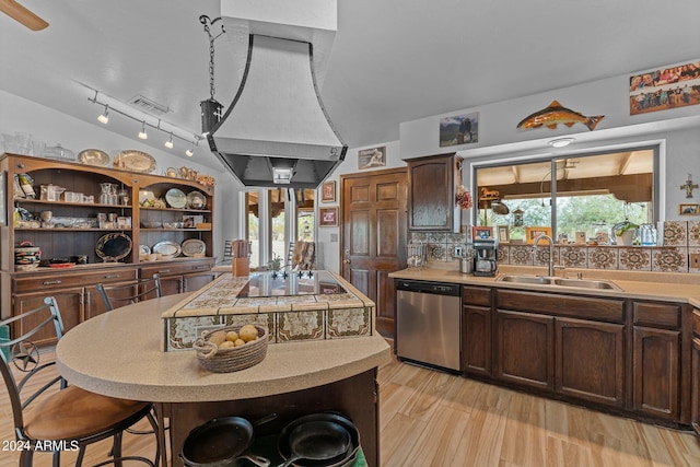 kitchen featuring black electric cooktop, a sink, light countertops, stainless steel dishwasher, and open shelves