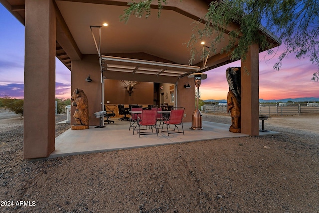 view of patio terrace at dusk